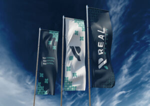 Real Realty brand identity on outdoor banners